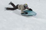 Sporty tobogganing downhill